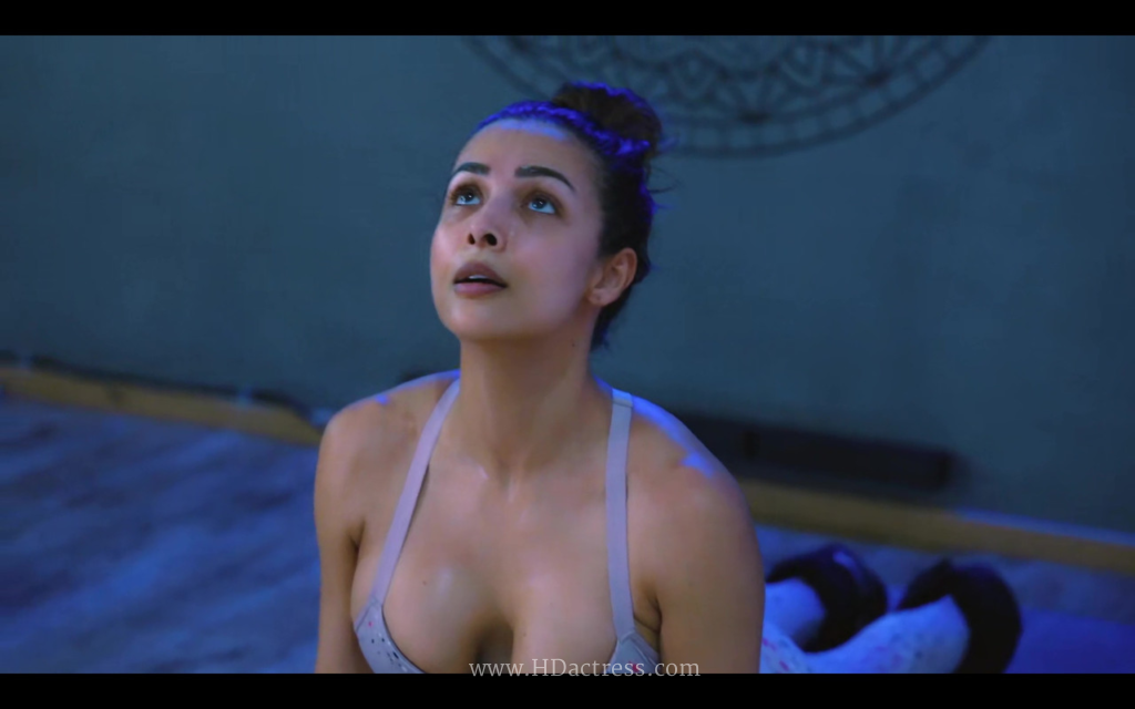 Malaika Arora full body yoga session in form-fitting athletic wear
