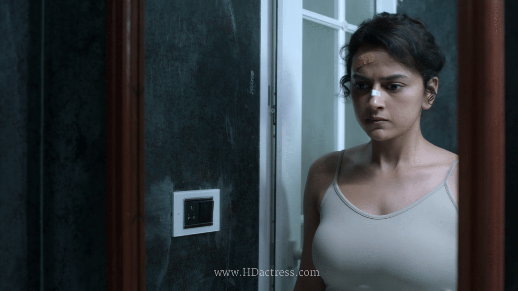 Close-up of Shraddha Srinath in bold sleeveless camisole showing her stunning figure