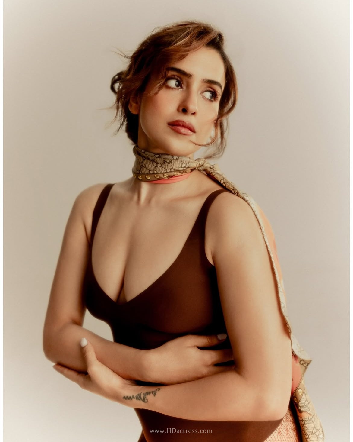 Sanya Malhotra, brown plunge bodysuit, lace tights, sexy photos, Instagram look, Bollywood actress, sultry photoshoot, body measurements, viral fashion, @sanyamalhotra_

