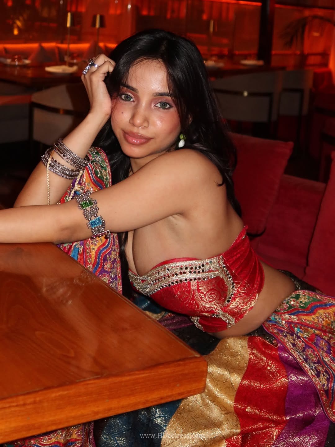 Muskan Karia posing in festive red Navratri wear with a deep-neck blouse