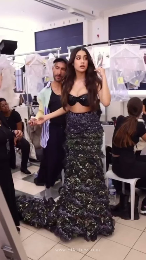 Janhvi Kapoor posing confidently in a fitted strapless bandeau top during her enchanting photoshoot