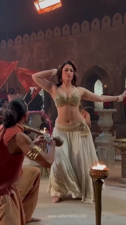 Tamannaah Bhatia showing off sexy curves and soft folds in a form-fitting outfit behind the scenes  

